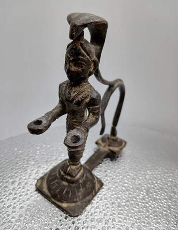 SCULPTURE OF COBRA WOMAN