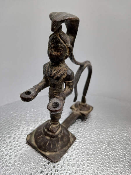 SCULPTURE OF COBRA WOMAN